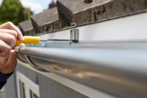 installing gutters on house